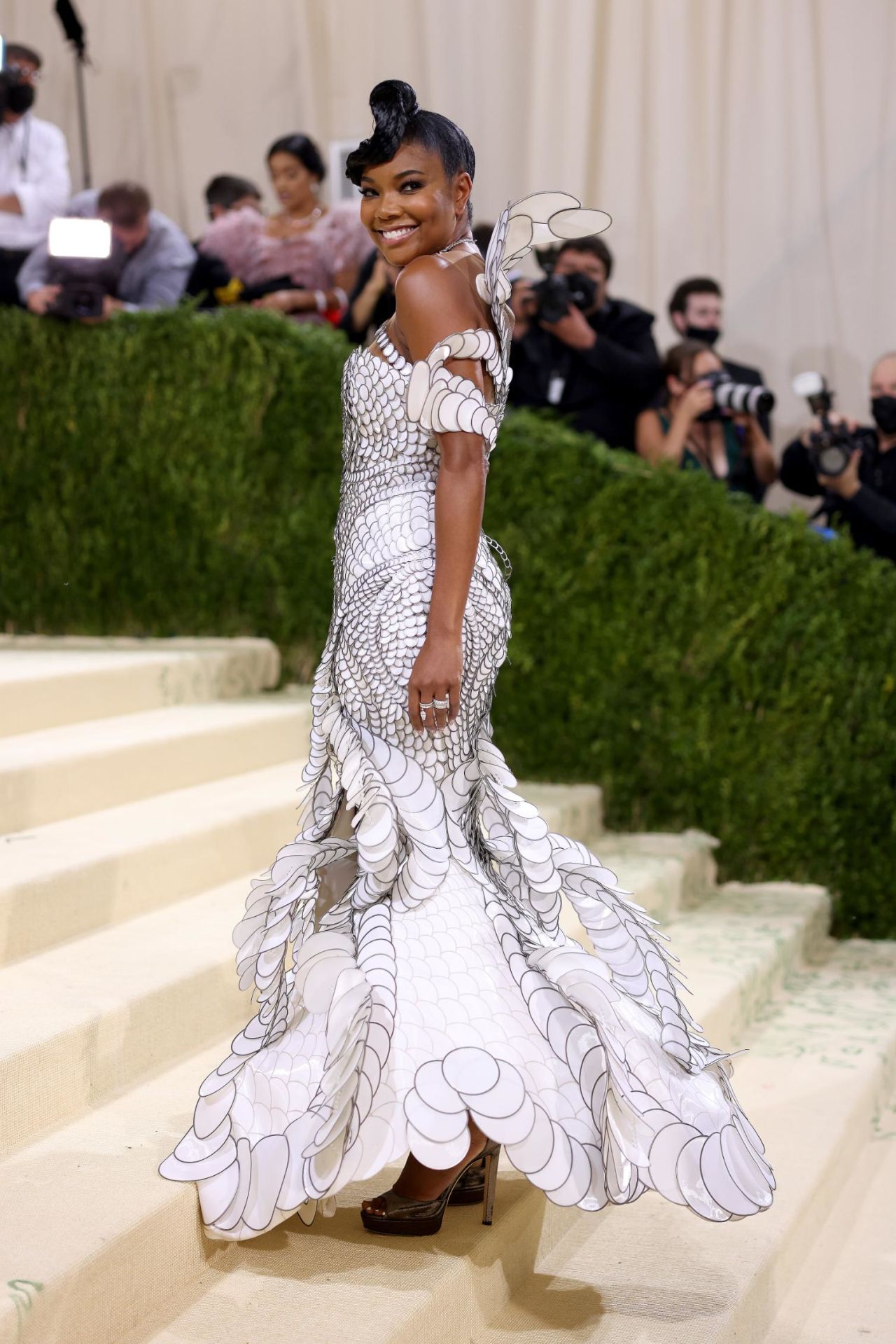 Actress Gabrielle Union wore a custom sculptural gown by designer Iris Van Herpen.  Made from over 10,000 laser cut 'liquid' fabric spheres, the dress took over 1,400 hours to create.