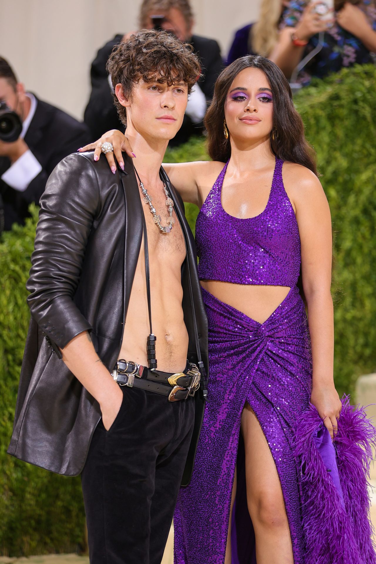 Shawn Mendes and Camilla Cabello arrived together for their Met Gala debut. Mendes went bare-chested under a leather jacket, while Cabello wore a sequined purple cut-out gown.