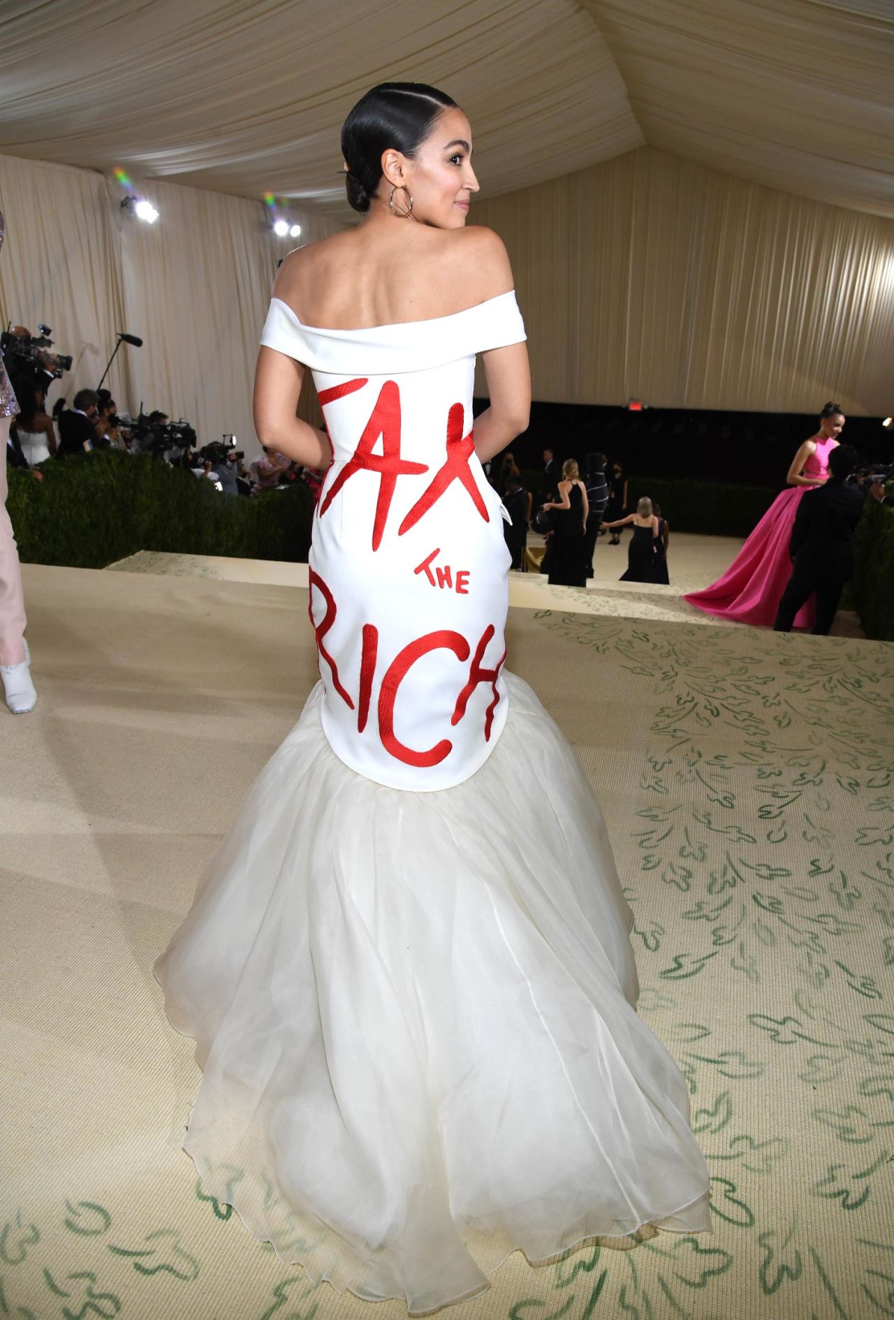 New York Congresswoman Alexandria Ocasio-Cortez made the statement "Tax the Rich" through a white tulle-hemmed mermaid gown by Brooklyn-based designer Brother Vellies.