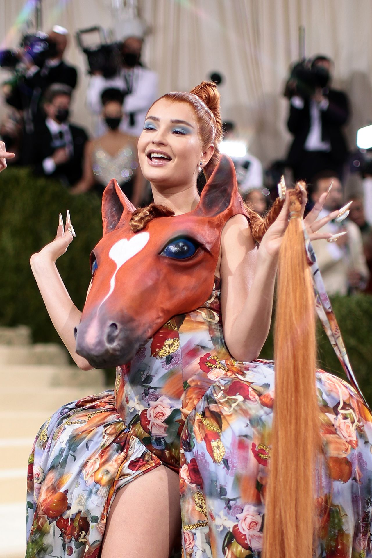 Kim Petras wore one of the more unusual looks of the night, donning a floral ballgown and horse head top by Collina Strada.