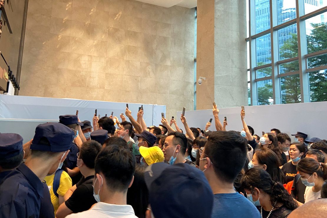 People gathering to demand repayment of loans and financial products at Evergrande's headquarters in Shenzhen on Monday. 