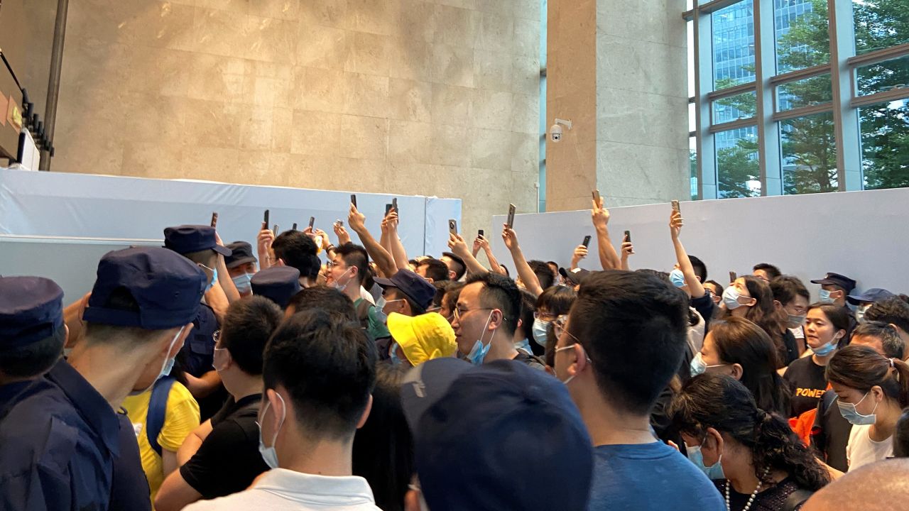 People gathering to demand repayment of loans and financial products at Evergrande's headquarters in Shenzhen on Monday.