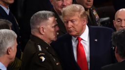 Chairman of the Joint Chiefs of Staff Gen. Mark Milley chats with President Donald Trump after he delivered the State of the Union address at the US Capitol in Washington, DC, on February 4, 2020.