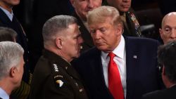 Chairman of the Joint Chiefs of Staff Gen. Mark Milley chats with US President Donald Trump after he delivered the State of the Union address at the US Capitol in Washington, DC, on February 4, 2020.