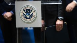 The U.S. Department of Homeland Security seal is seen as DHS Secretary Alejandro Mayorkas delivers remarks while visiting a FEMA community vaccination center on March 2, 2021 in Philadelphia, Pennsylvania. 