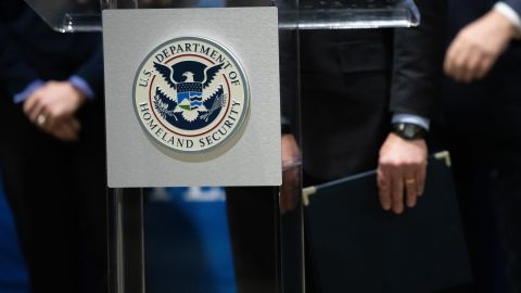 The Department of Homeland Security seal is seen as DHS Secretary Alejandro Mayorkas delivers remarks while visiting a FEMA community vaccination center on March 2, 2021 in Philadelphia.
