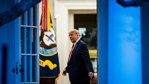 President Donald J. Trump talks with others in the Oval Office at the White House on Friday, November 13, 2020.