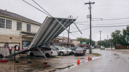 A carport hangs from power-lines after Tropical Storm Nicholas moved through the area on September 14, 2021 in Houston, Texas. Tropical Storm Nicholas strengthened to a Category 1 hurricane as it made landfall late Monday evening, but is gradually weakening as it moves towards the Northeast. Nicholas is projected to become a tropical depression by tomorrow.