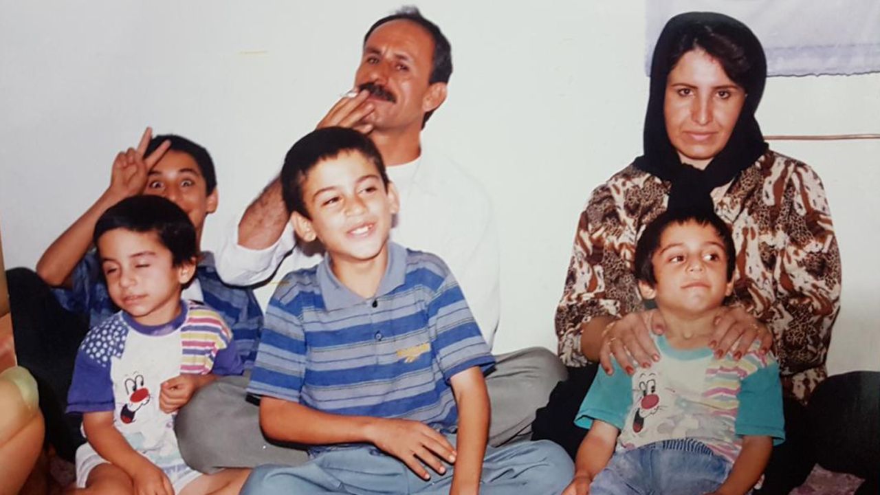 Navid Afkari (bottom left), sitting with his brother Vahid (top left), brother Saeid (bottom center), brother Habib (bottom right), father (top center) and mother (top right).