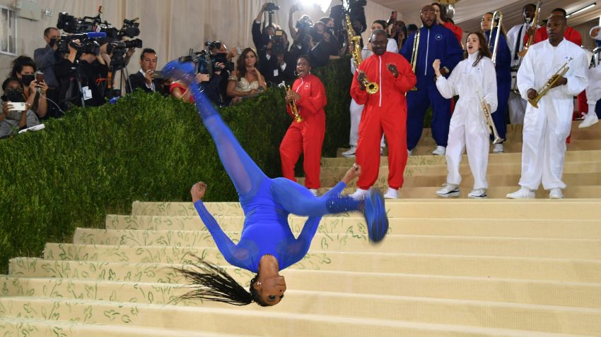TOPSHOT - US gymnast Nia Dennis arrives for the 2021 Met Gala at the Metropolitan Museum of Art on September 13, 2021 in New York. - This year's Met Gala has a distinctively youthful imprint, hosted by singer Billie Eilish, actor Timothee Chalamet, poet Amanda Gorman and tennis star Naomi Osaka, none of them older than 25. The 2021 theme is "In America: A Lexicon of Fashion." (Photo by ANGELA  WEISS / AFP) (Photo by ANGELA  WEISS/AFP via Getty Images)