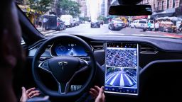 A driver rides hands-free in a Tesla Motors Inc. Model S vehicle equipped with Autopilot hardware and software in New York, U.S. on Monday, Sept. 19, 2016. 