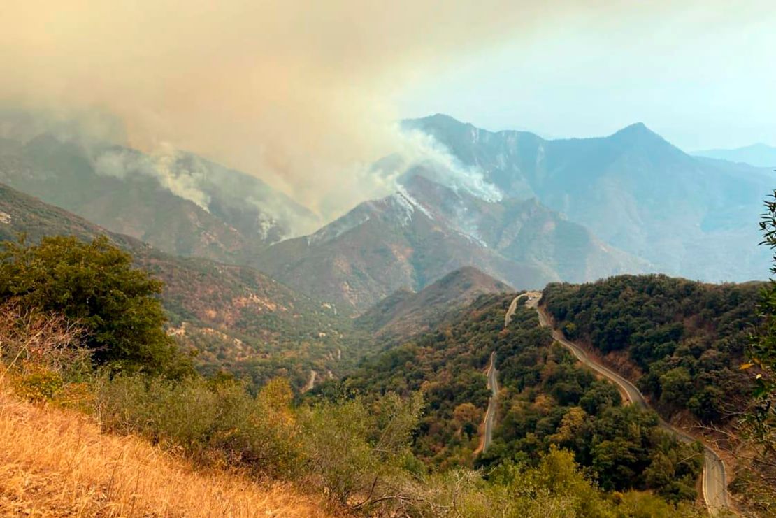 In this Sunday, September 12 photo released by the KNP Complex Fire Incident Command, smoke plumes rise from the Paradise Fire in Sequoia National Park, California.