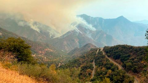 In this Sunday, September 12 photo released by the KNP Complex Fire Incident Command, smoke plumes rise from the Paradise Fire in Sequoia National Park, California.