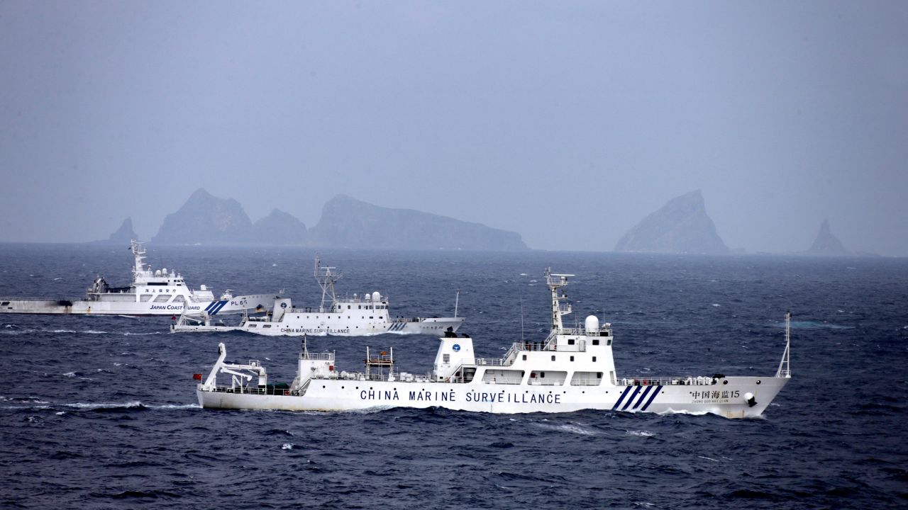 China Marine Surveillance vessels (front and middle) cruise with a Japan Coast Guard ship near Kitakojima and Minamikojima of the disputed Senkaku Islands on April 23, 2013.