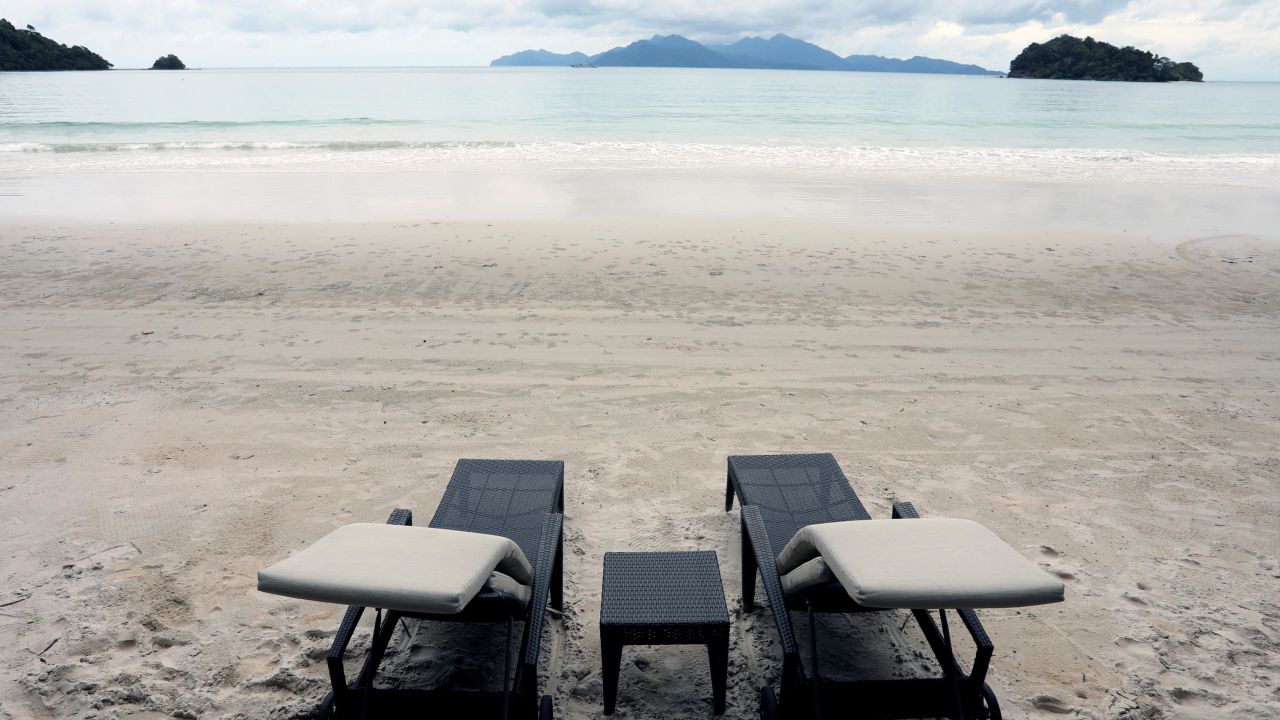 Empty chairs are seen at The Datai Langkawi resort beach, as Langkawi gets ready to open to domestic tourists from September 16, amid the coronavirus disease (COVID-19) outbreak, Malaysia September 14, 2021. REUTERS/Lim Huey Teng