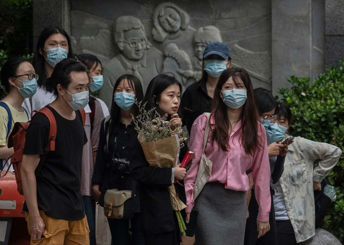 Zhou Xiaoxuan, known also as Xianzi, stands with supporters outside a Beijing court on September 14.