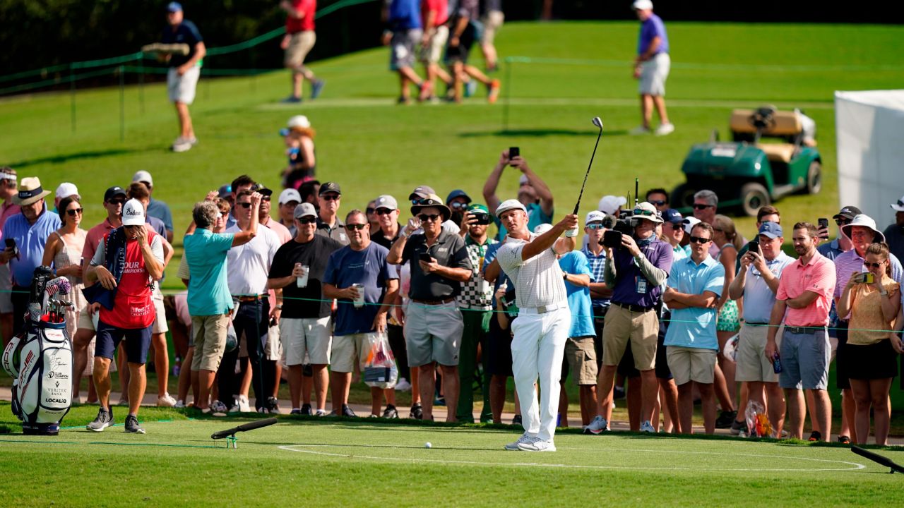 DeChambeau hits from a drop on the 15th hole during the first round of the Tour Championship.