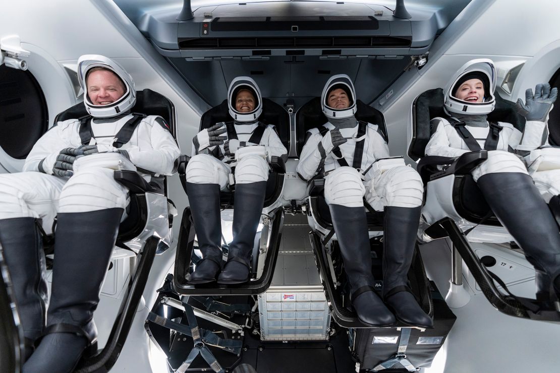From left, Chris Sembroski, Sian Proctor, Jared Isaacman and Hayley Arceneaux sit in the Dragon capsule at Cape Canaveral in Florida on Sept. 12, 2021 during a dress rehearsal for the upcoming launch. 