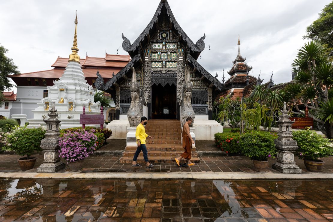 A monk walks through a near empty Wat Chedi Luang in Chiang Mai, Thailand, on September 9, 2021.