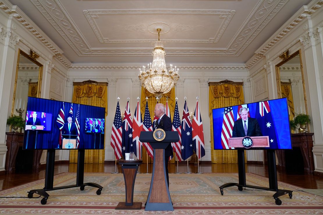 President Joe Biden, listens as he is joined virtually by Australian Prime Minister Scott Morrison, left, and British Prime Minister Boris Johnson, speaks about a national security initiative in the East Room of the White House in Washington, Wednesday, Sept. 15, 2021. 