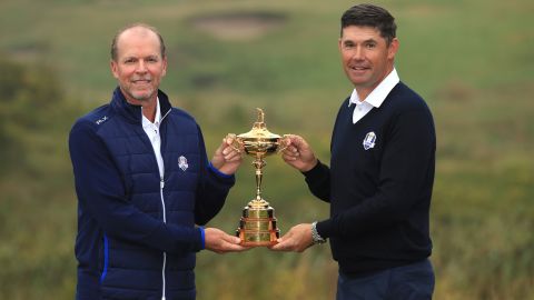 Stricker (left) and Harrington (right) pose with the Ryder Cup.