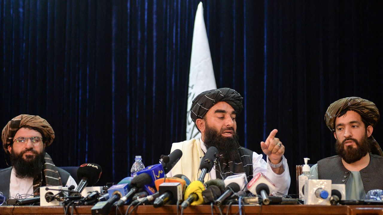 Taliban spokesman Zabihullah Mujahid (C) gestures as he addresses the first news conference in Kabul on August 17, following the Taliban's takeover of Afghanistan.