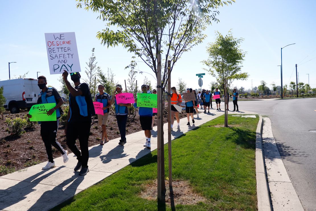 Drivers for Amazon DSPs protest outside a Amazon delivery station in Portland, Oregon this June.