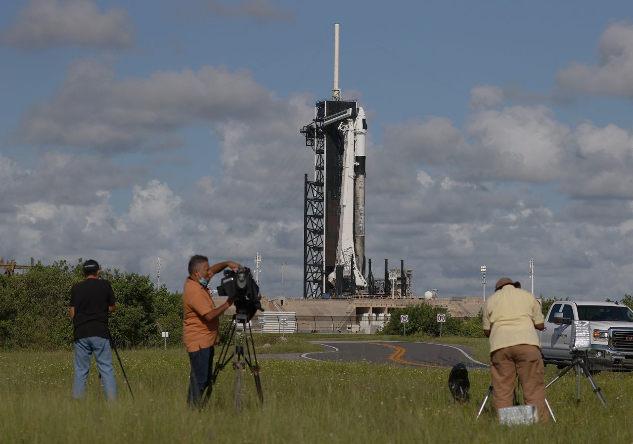 Camera operators set up to record the launch.