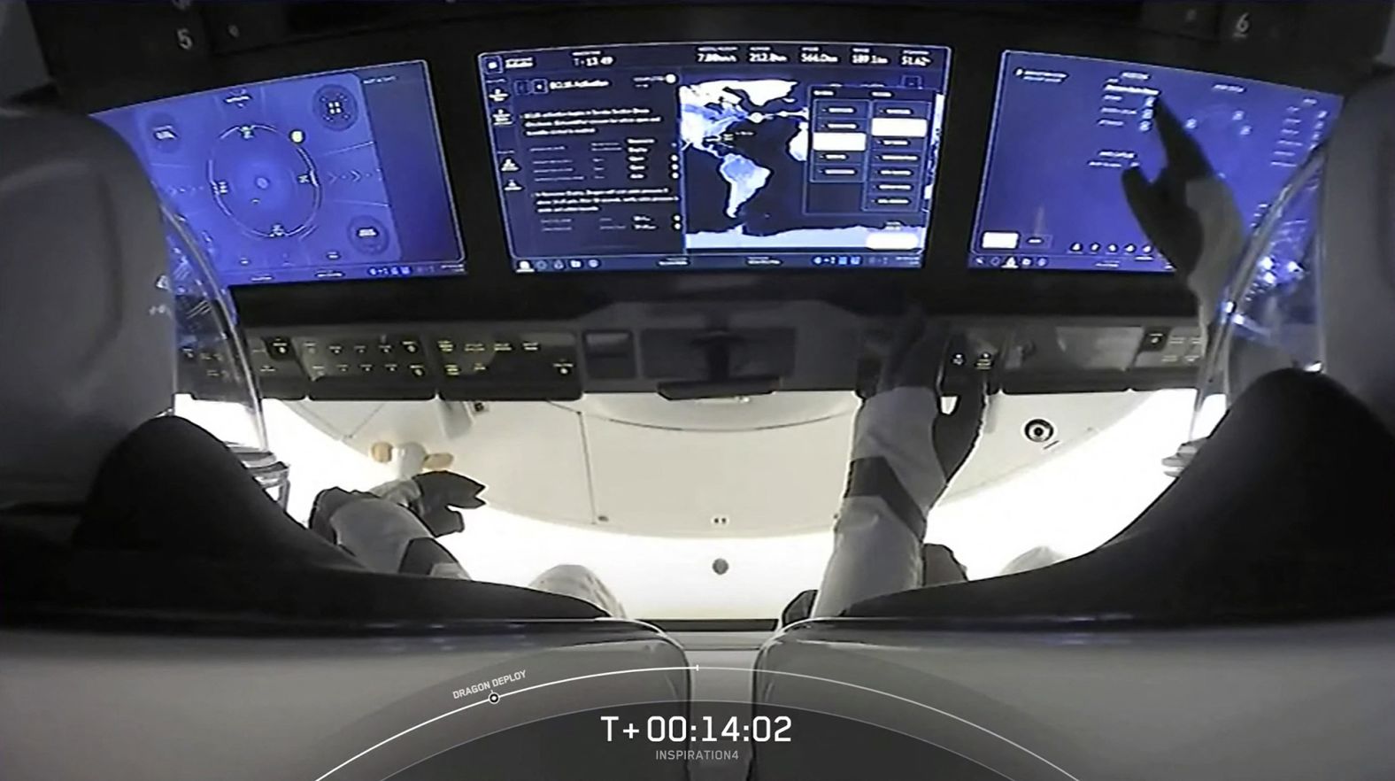 Proctor interacts with the dashboard on the Crew Dragon capsule.