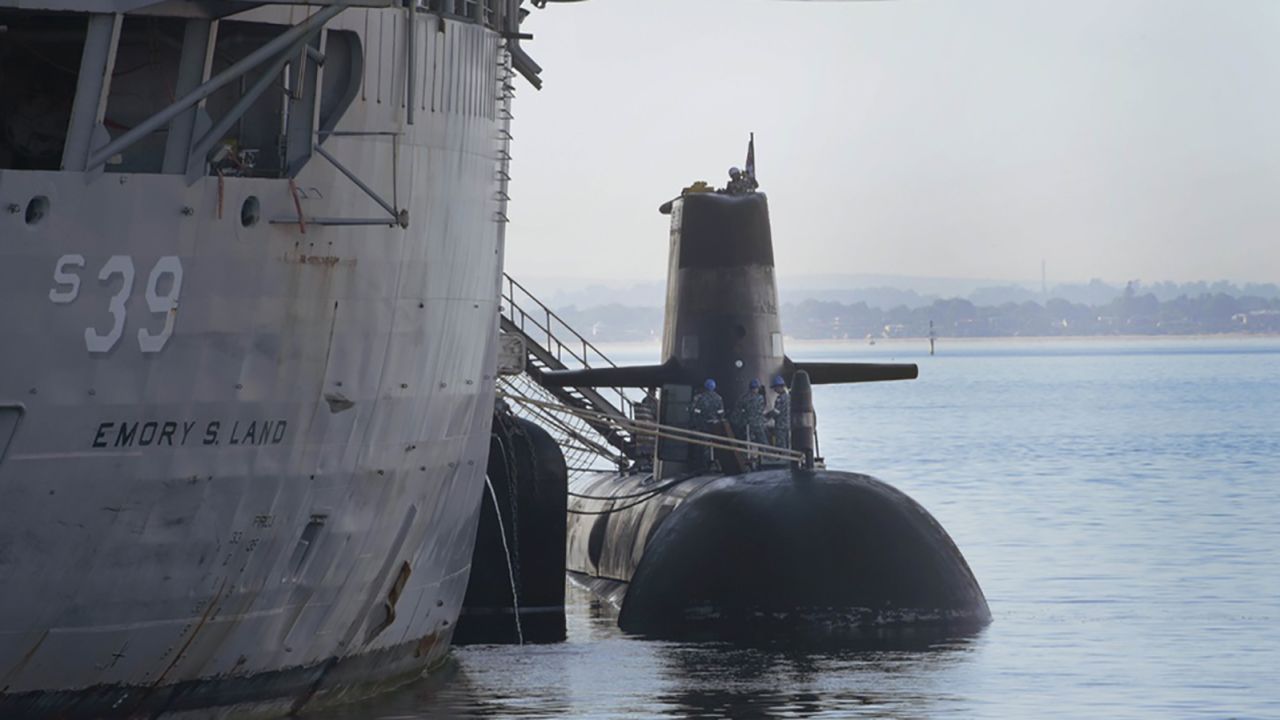 Sailors assigned to the Australian Collins-class submarine HMAS Sheean (SSG 77) prepare to receive hotel services and supplies during bilateral training event with USS Emory S. Land (AS 39) on September 13, 2019.