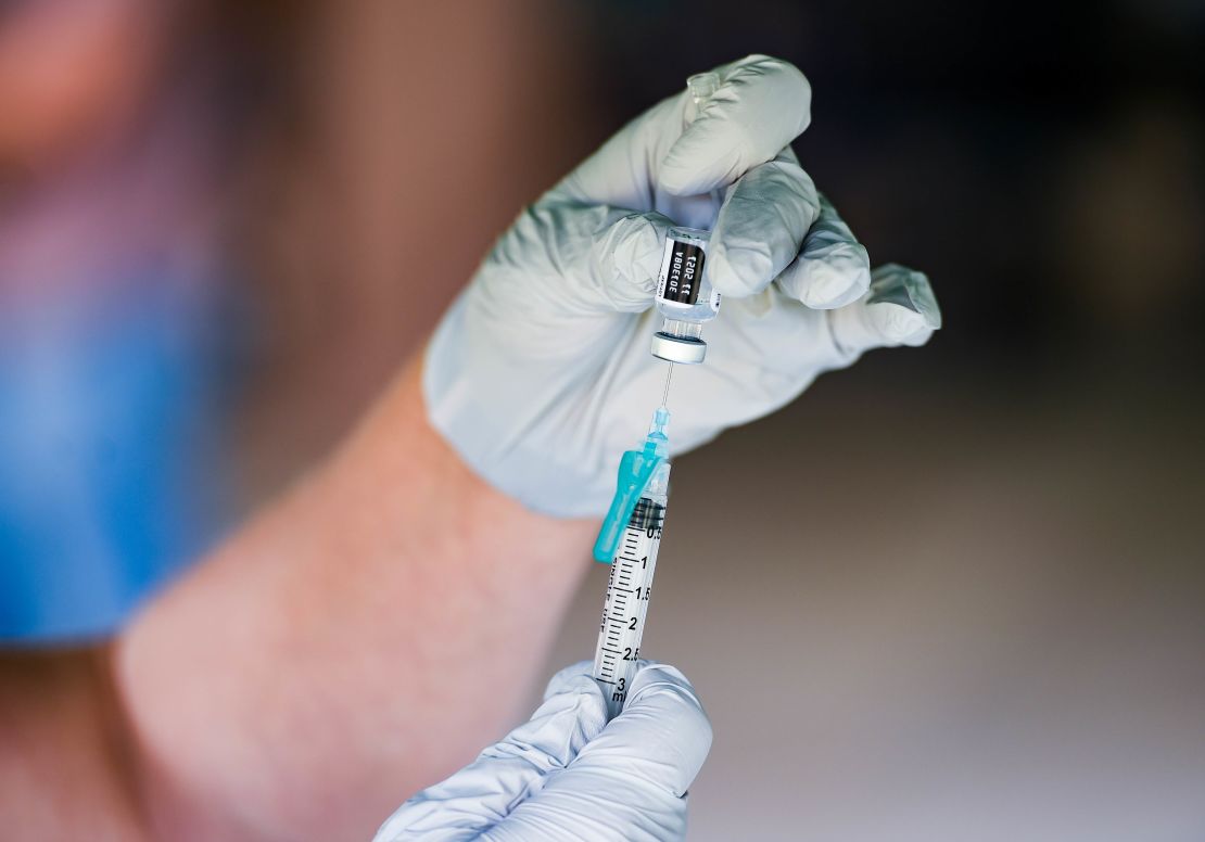 A nurse fills a syringe with a dose of Pfizer/BioNTech Covid-19 vaccine at the Reading Area Community College campus in Reading, Pennsylvania, on September 14, 2021.