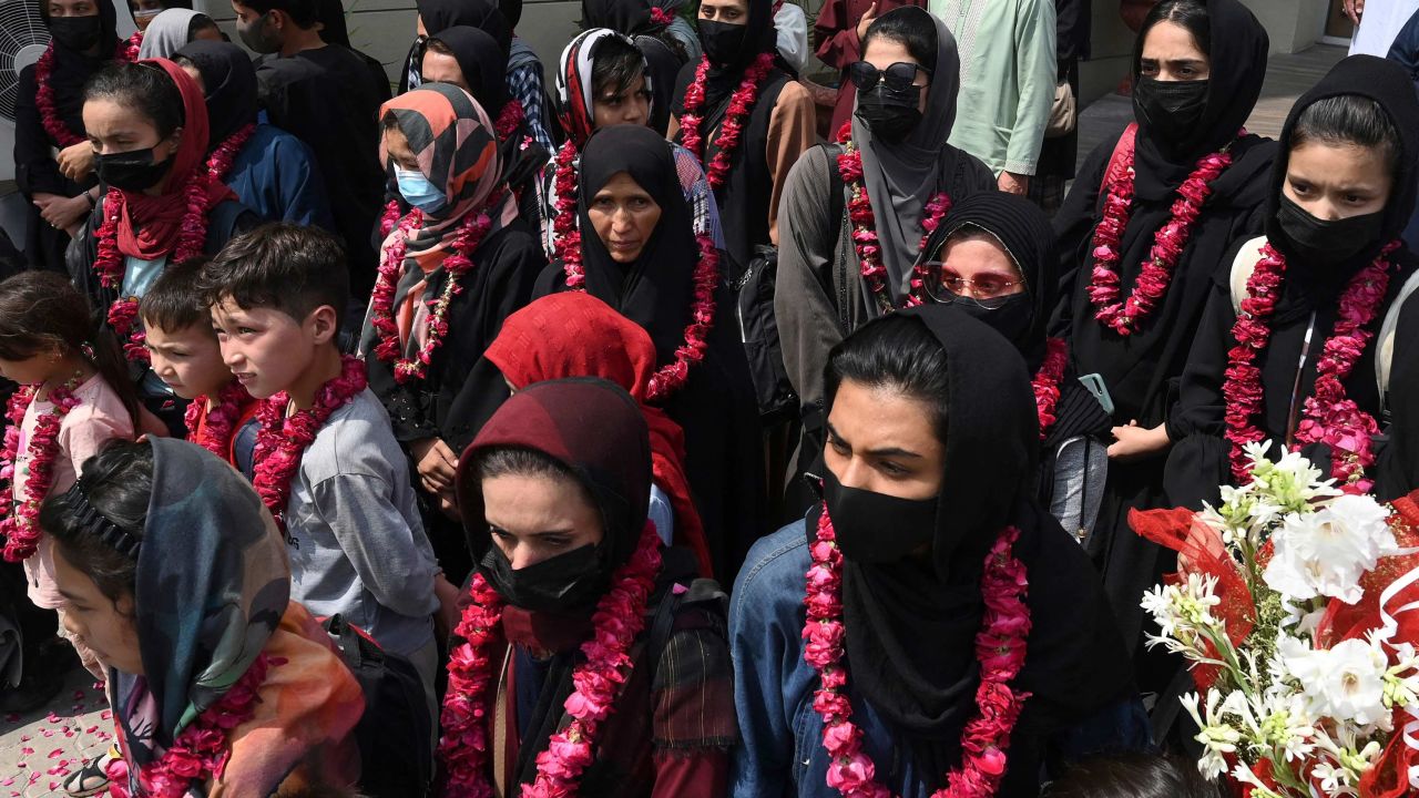 TOPSHOT - Members of Afghanistan's national girls football team arrive at the Pakistan Football Federation (PFF) in Lahore on September 15, 2021, a month after the hardline Taliban swept back into power officials said. (Photo by Arif ALI / AFP) / The erroneous mention[s] appearing in the metadata of this photo by Arif ALI has been modified in AFP systems in the following manner: [team arrive] instead of [dressed in burqas]. Please immediately remove the erroneous mention[s] from all your online services and delete it (them) from your servers. If you have been authorized by AFP to distribute it (them) to third parties, please ensure that the same actions are carried out by them. Failure to promptly comply with these instructions will entail liability on your part for any continued or post notification usage. Therefore we thank you very much for all your attention and prompt action. We are sorry for the inconvenience this notification may cause and remain at your disposal for any further information you may require. (Photo by ARIF ALI/AFP via Getty Images)