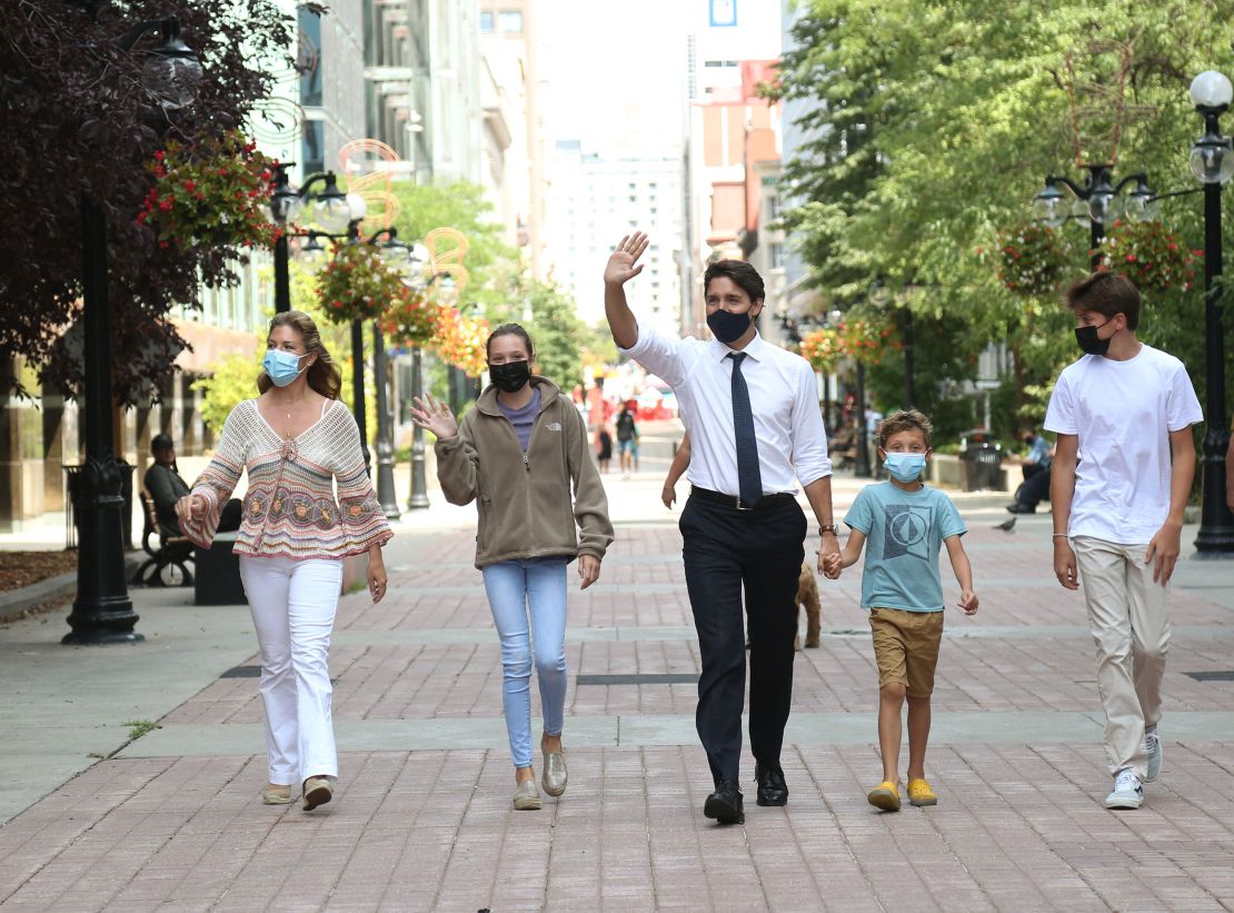 Canada's Prime Minister Justin Trudeau, his wife Sophie Gregoire Trudeau  and their children walk to the campaign bus on August 15, 2021 in Ottawa, Canada. 