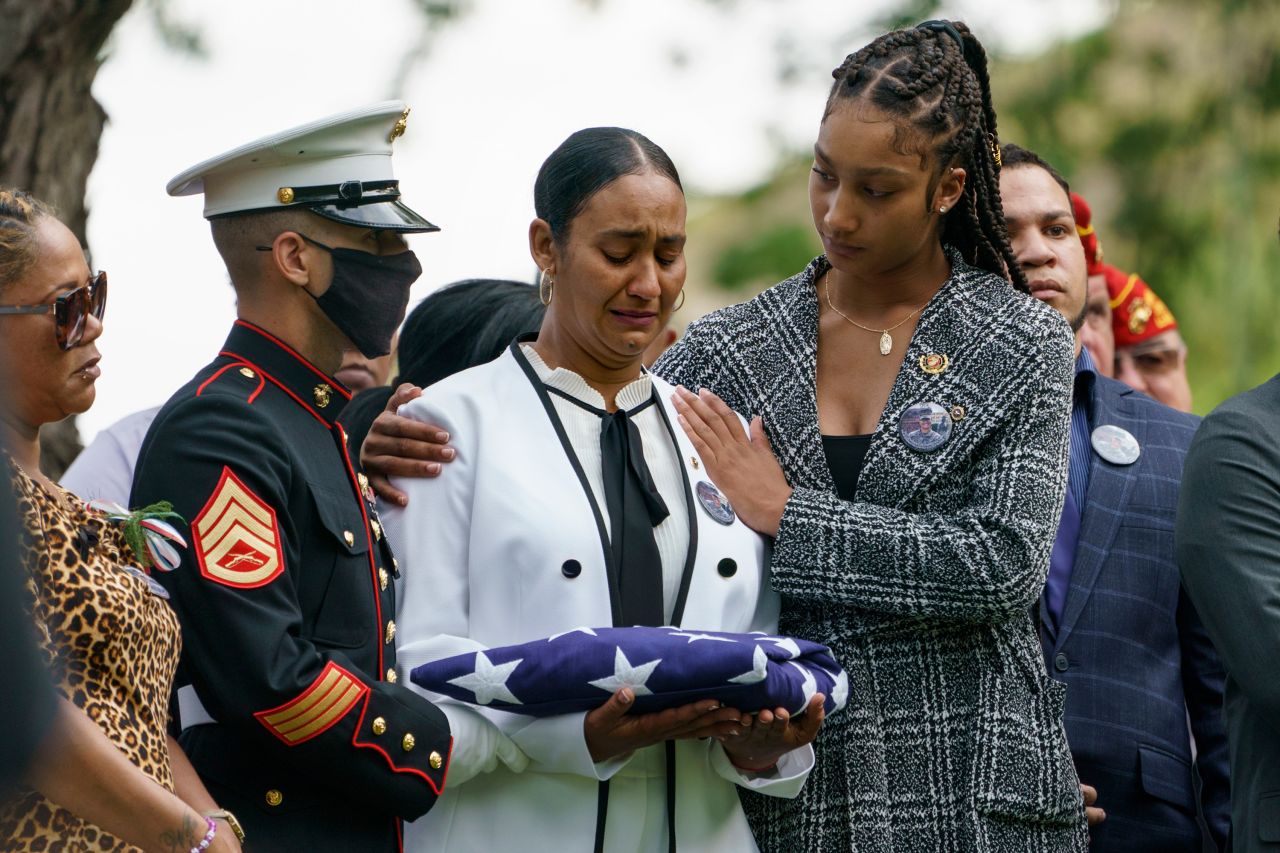 Colasa Pichardo, center, is comforted by her daughter Rosalinda Rosario during a burial service in Lawrence, Massachusetts, on Tuesday, September 14. Pichardo's daughter Johanny Rosario Pichardo, 25, was a US Marine sergeant and one of the 13 American service members killed in a <a href="https://www.cnn.com/2021/08/26/middleeast/gallery/kabul-deadly-blasts-afghanistan-airport/index.html" target="_blank">suicide bombing in Afghanistan on August 26.</a>