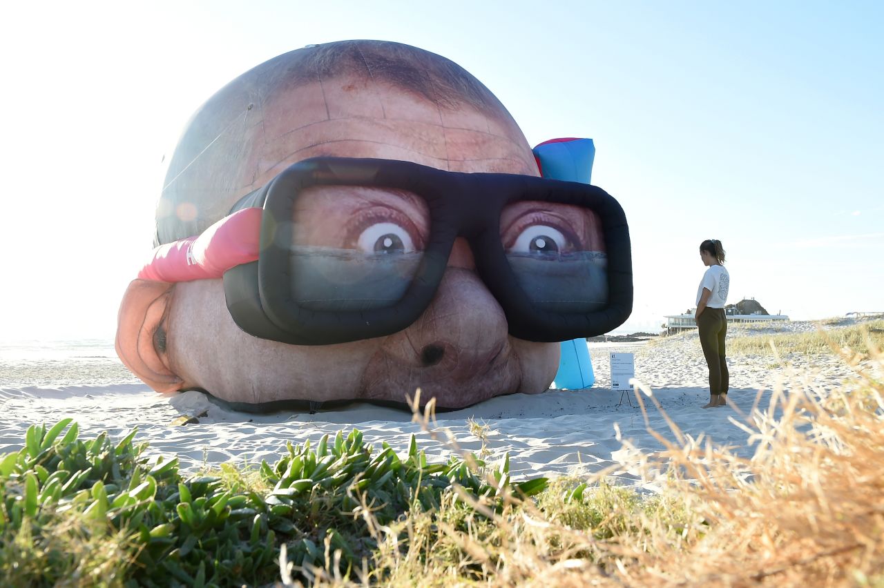 A sculpture by Danger Dave, "Damien Hirst Looking for Sharks," is seen on Australia's Currumbin Beach on Monday, September 13. It is part of the annual Swell Sculpture Festival. Hirst is a famous British artist, and one of his famous artworks features a large tiger shark suspended in formaldehyde.