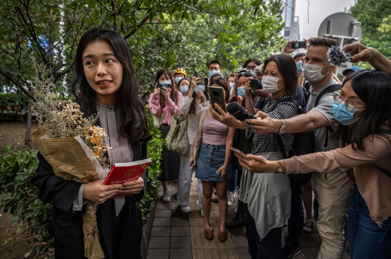 Zhou Xiaoxuan, a leading figure in China's #MeToo movement, speaks to journalists and supporters in Beijing before a hearing in her case against prominent television host Zhu Jun on Tuesday, September 14. A court in Beijing <a href="https://www.cnn.com/2021/09/15/china/xianzi-zhu-jun-sexual-harassment-case-mic-intl-hnk/index.html" target="_blank">ruled against her,</a> citing "insufficient evidence." Zhu has not directly commented on the case in public. He has denied all allegations through his lawyer and filed a separate lawsuit against Zhou for defamation, according to a statement from his lawyer in 2018.