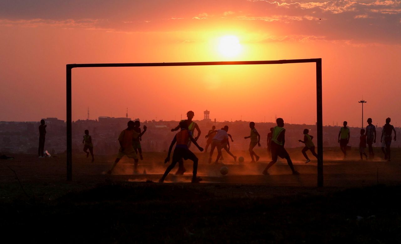 People play soccer on a dusty field in Soweto, South Africa, on Wednesday, September 15. <a href="http://www.cnn.com/2021/09/09/world/gallery/photos-this-week-september-3-september-9/index.html" target="_blank">See last week in 40 photos</a>