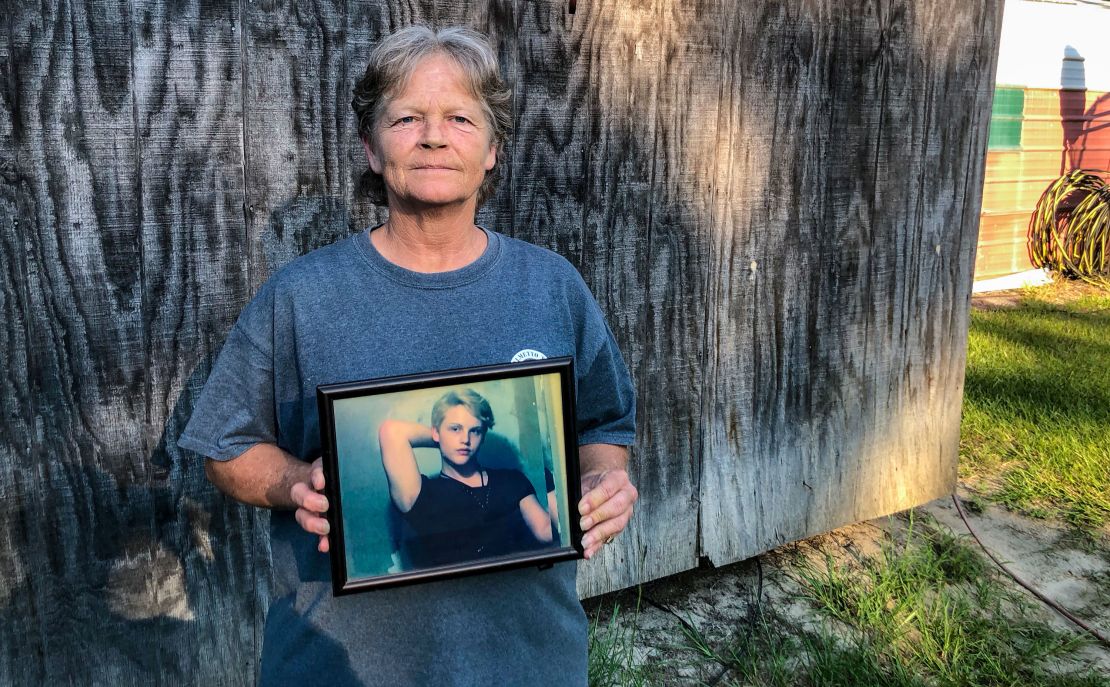Sandy Smith holds a photo of her late son, Stephen Smith, in June. "There will never be another one like him," she said. 