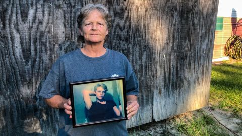 Sandy Smith holds a photo of her late son, Stephen Smith, in June. "There will never be another one like him," she said.