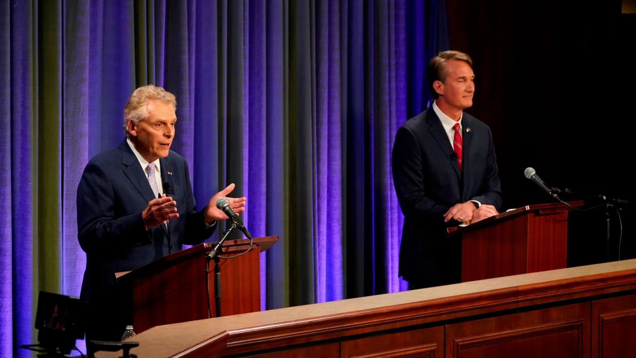 Democratic gubernatorial candidate and former Gov. Terry McAuliffe, left, gestures as his Republican challenger, Glenn Youngkin, looks on during their debate on Thursday, September 16, 2021. 