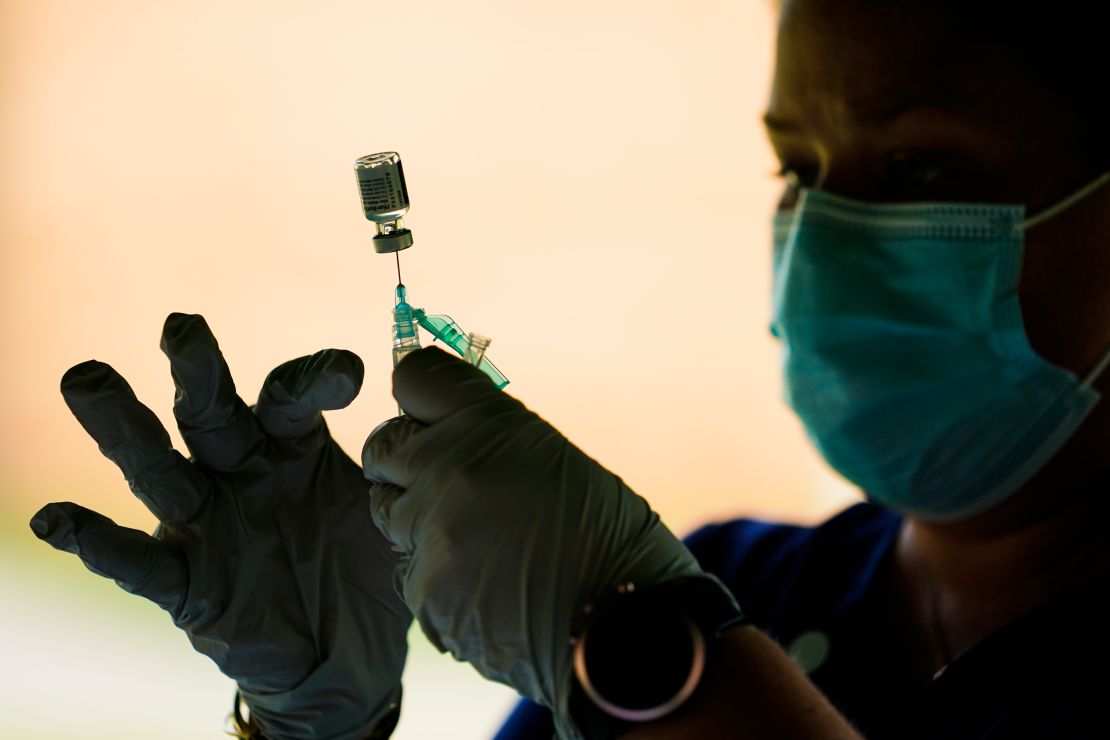 A syringe is prepared with the Pfizer vaccine at a clinic at the Reading Area Community College in Reading, Pennsylvania.