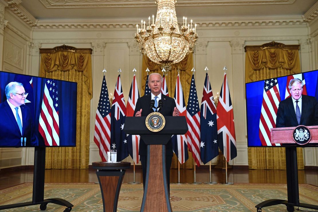 US President Joe Biden speaks on national security with British Prime Minister Boris Johnson, right, and Australian Prime Minister Scott Morrison, left, in East Room of the White House in Washington, DC, on September 15.