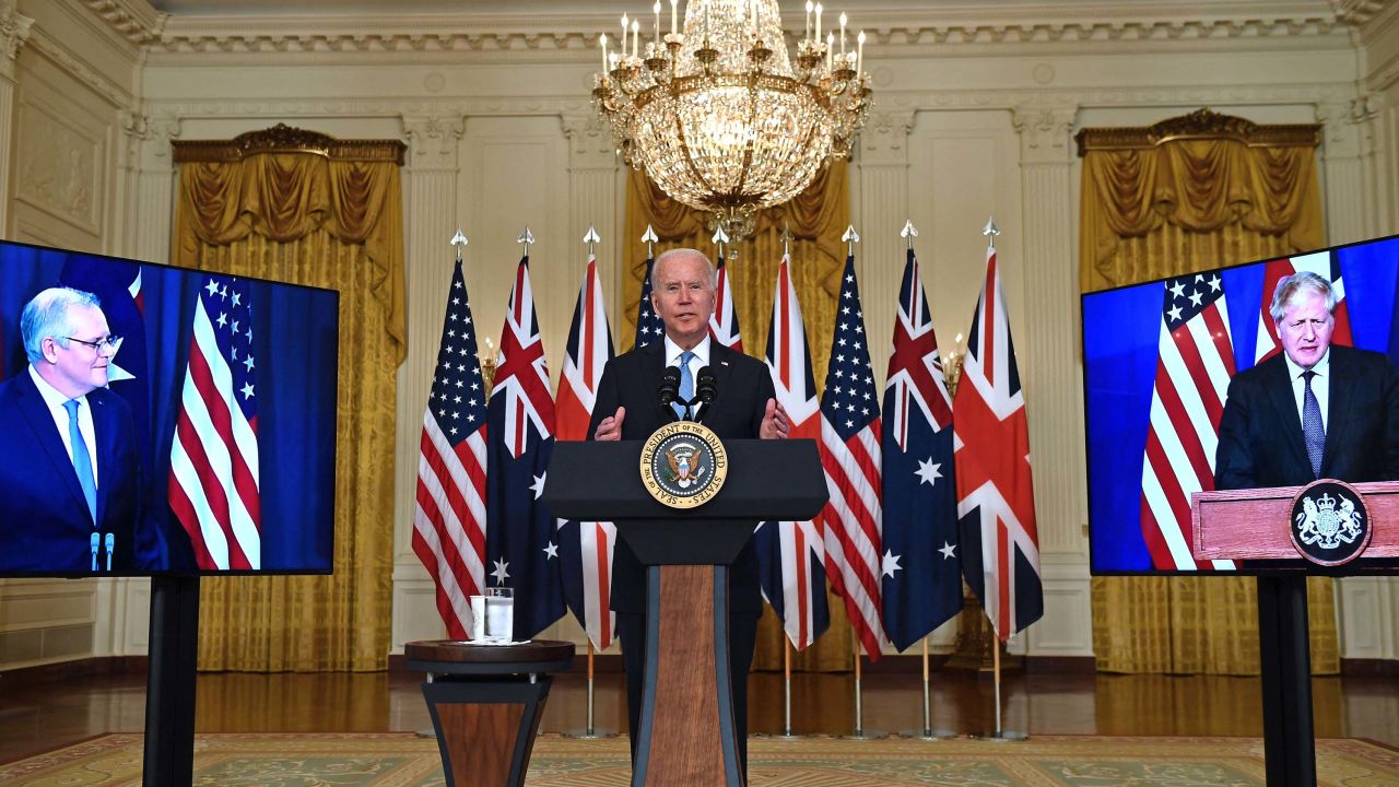 US President Joe Biden speaks on national security with British Prime Minister Boris Johnson, right, and Australian Prime Minister Scott Morrison, left, in East Room of the White House in Washington, DC, on September 15.