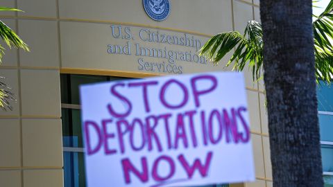 Demonstrators protest outside the US Citizenship and Immigration Service office in Miami, on February 20, 2021, demanding that the administration of US President Joe Biden cease deporting Haitian immigrants back to Haiti. 