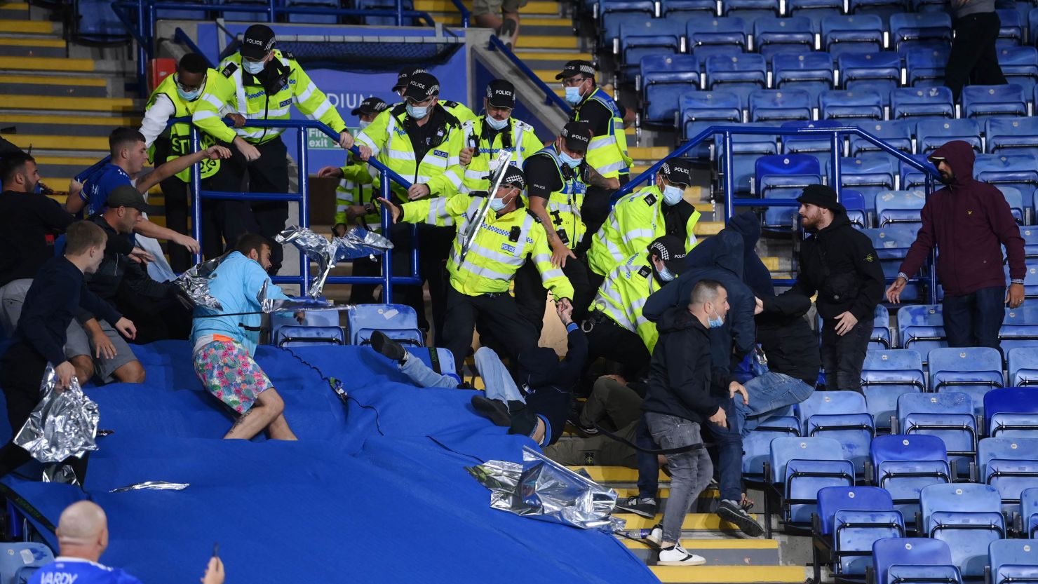Fans from both side's clash as police intervene inside the King Power Stadium.