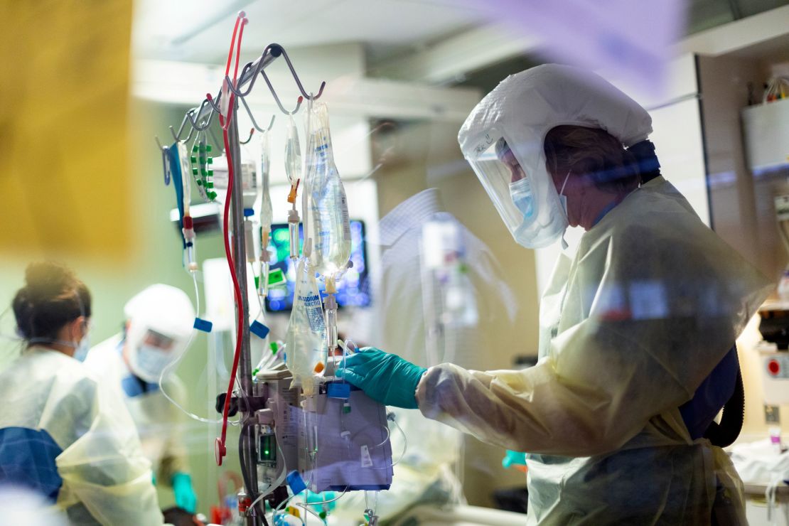 Jack Kingsley, a registered nurse, attends to a Covid-19 patient in the Medical Intensive Care Unit at St. Luke's Boise Medical Center in Idaho. 