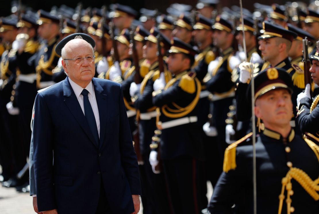 Lebanese Prime Minister Najib Mikati, reviews an honor guard during a ceremony at the Government House in downtown Beirut, Lebanon, on September 13, 2021.