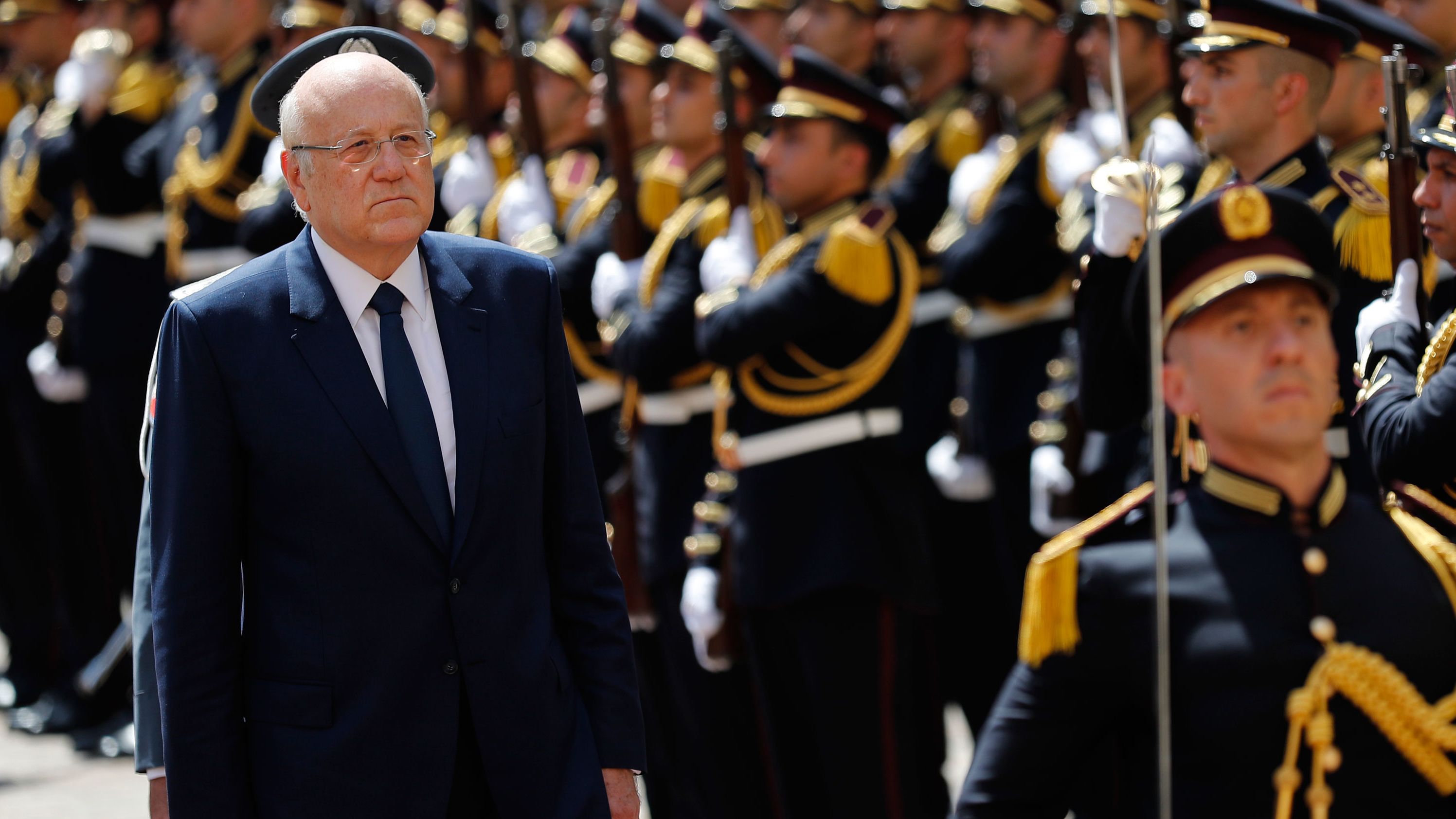 Lebanese Prime Minister Najib Mikati, reviews an honor guard during a ceremony at the Government House in downtown Beirut, Lebanon, on September 13, 2021.