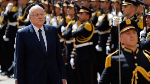Lebanese Prime Minister Najib Mikati, reviews an honor guard during a ceremony at the Government House in downtown Beirut, Lebanon, on September 13, 2021.