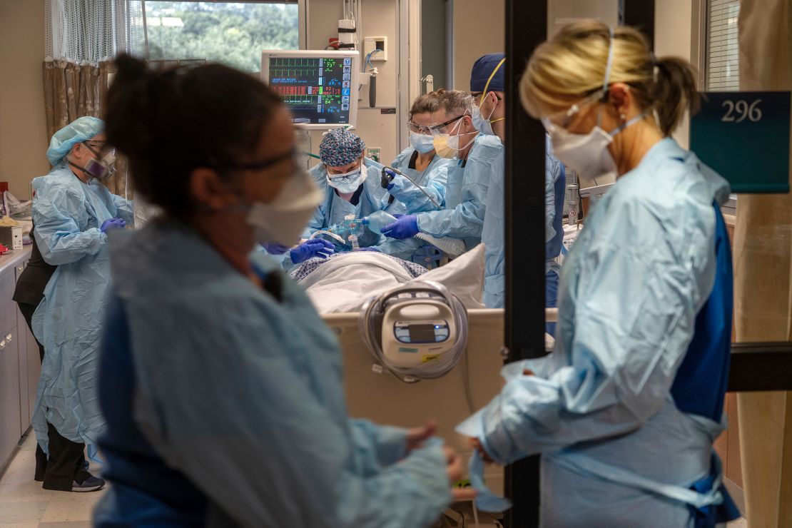 A nurse in a Clearwater, Florida, hospital prepares to help place a positive Covid-19 patient on a respirator.